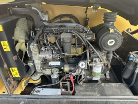 Телескопични товарачи Caterpillar CAT TH 414, снимка 14