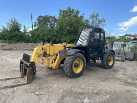 Телескопични товарачи Caterpillar CAT TH 414, снимка 6