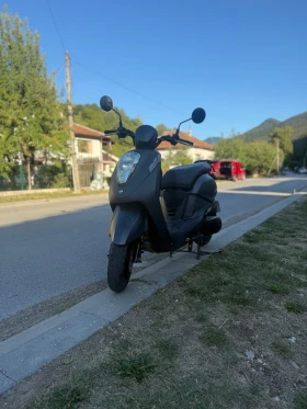     Sym Mio 100