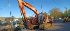 Багер Hitachi ZX135 US
