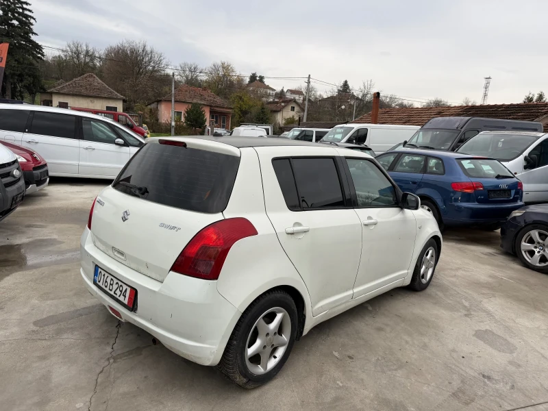 Suzuki Swift 1.3i КЛИМАТИК, снимка 5 - Автомобили и джипове - 52717612