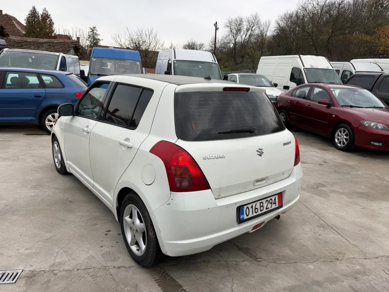 Suzuki Swift 1.3i КЛИМАТИК, снимка 7 - Автомобили и джипове - 52717612