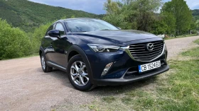 Mazda CX-3 Bose + keyless + хедъп + парк.+ Navi + 64х. км  | Mobile.bg — малка снимка 1