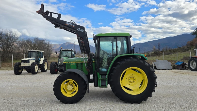 Трактор John Deere 6400.Челен товарач